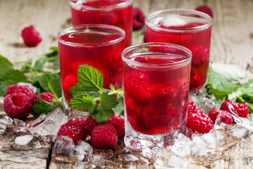 Refreshing raspberry drink with berries, ice and mint, selective