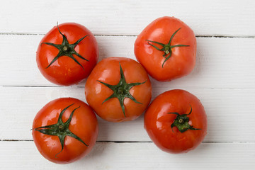 Red tomatoes fruits isolated on white