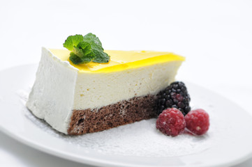 lemon cream cake with fruit and gelatin on white plate, sweet dessert, product photography for patisserie or shop