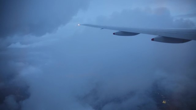 Traveling by air. View through an airplane window while the storm and shake.