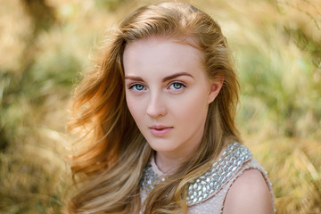 Fototapeta premium Vogue style portrait of young girl on meadow