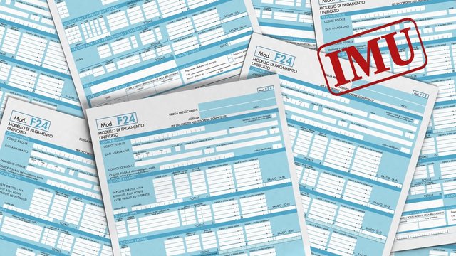 f24 forms and stamps with the name of italian taxes coming from back the camera