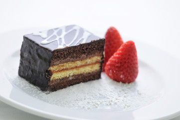 sponge cake with strawberries on white plate, product photography for shop or patisserie