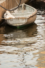 Obraz premium Old boat in harbor on pier