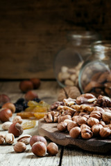 Nuts set of pistachios, walnuts, almonds and hazelnuts on a wood