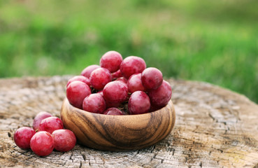 Grapes in  wooden plate outdoor in the garden