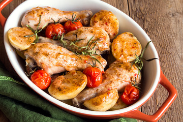 Oven baked chicken legs with vegetables