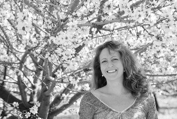 Spring portrait of beautiful 40 years old woman outdoors