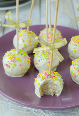 Cake pops with white chocolate and sprinkles 