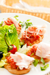 Bruschetta with tomato and ham