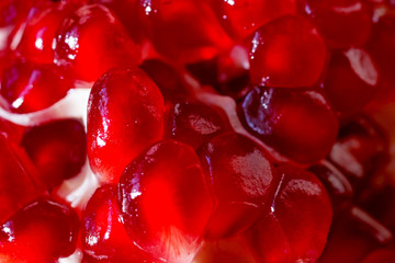 Ripe red pomegranate seeds closeup