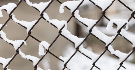 Fototapeta premium Snow on fence in winter