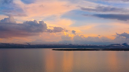 Naklejka na ściany i meble beautiful landscape lake Sevan spring sunset