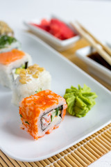 Sushi set on white wooden background
