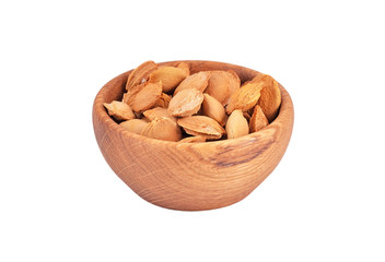 Apricot stone in wooden bowl