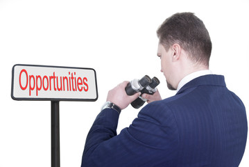 Businessman looking for business opportunities with binoculars (