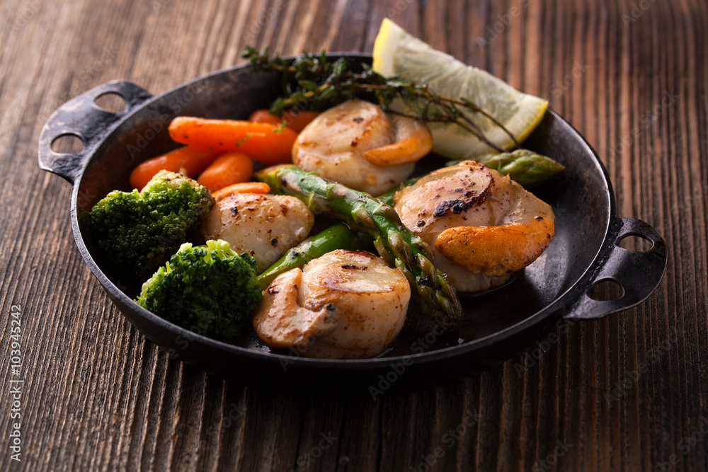 Canvas Prints Fried scallops in a sauce with asparagus and broccoli