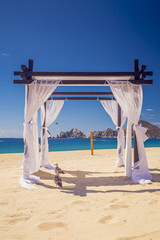 site of a wedding ceremony on the beach