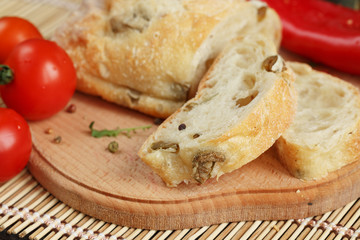 Sliced bread Ciabatta and vegetables