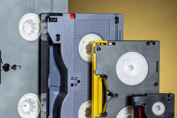  Broadcast video tapes of different formats and sizes, on orange background