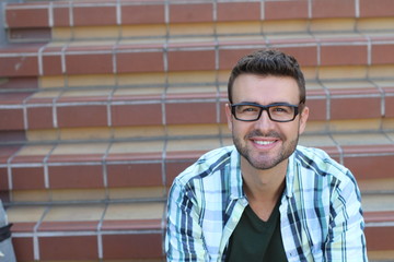 Fototapeta premium Nerdy handsome smart student portrait with copy space on the left 
