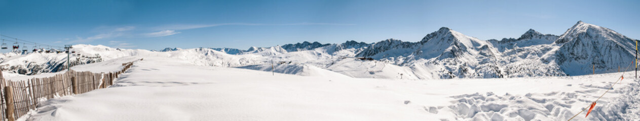 Fototapeta na wymiar Panoramic view of beautiful snowy mountains in a sky station