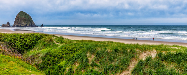 Oregon Cannon Beach panorama with famous Haystack Rock in the ba