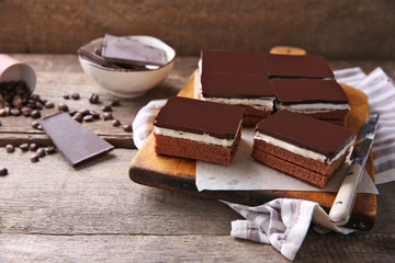 Delicious chocolate brownies on wooden background