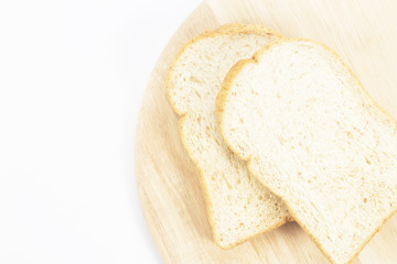 Place the bread on wood isolated white backdrop.