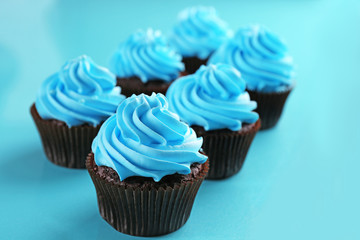 Chocolate cupcakes on blue background