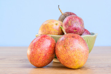 Fresh passion fruit isolated on wooden background