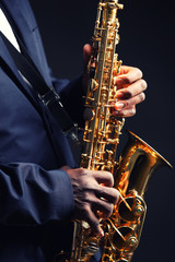 Fototapeta premium African American jazz musician playing the saxophone, closeup
