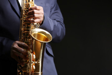 Obraz premium African American jazz musician playing the saxophone, closeup