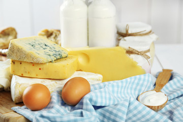 Set of fresh dairy products on white wooden table