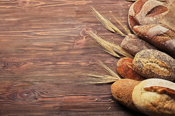 Fresh baked bread on the wooden background