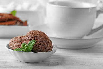 Chocolate chip cookie in plate with mint, closeup