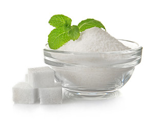 Pile of sugar cubes and stevia isolated on white background