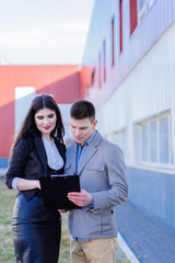 Obraz premium discussing documents by Business partners