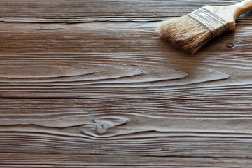 Painting natural wood with paint brush 