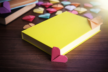 Heart bookmarks for books on wooden background