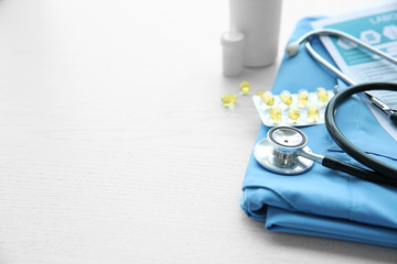 Stethoscope and medical equipment on a light blue background