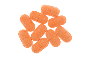 Vitamin C pills on white