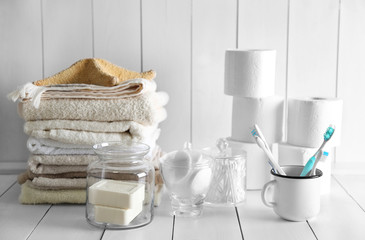 Bath accessories on wooden wall background