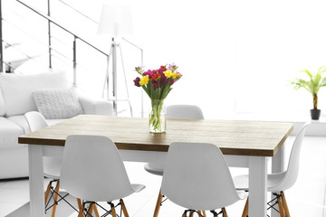 Beautiful comfortable modern interior with table and chairs