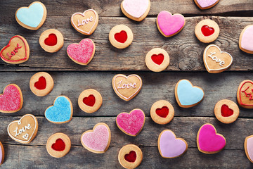Assortment of love cookies on wooden background