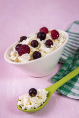 cottage cheese with fruit on a wooden table