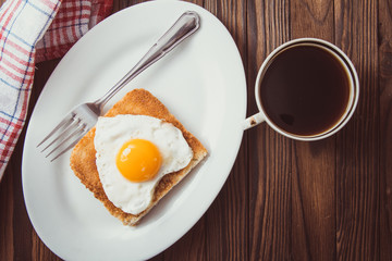 fried egg with toast on a plate