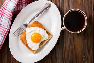 fried egg with toast on a plate