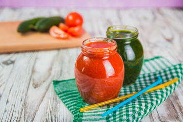 glasses of various smoothies with straws for healthy dieting breakfast