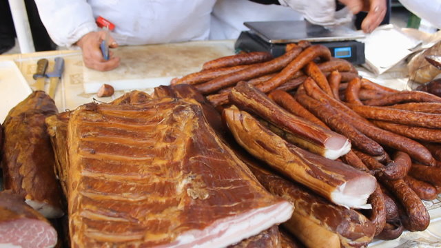  Smoked dried Bacon ham and sausages  Meat market festival,handheld camera tracking focus
